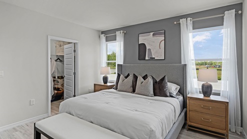 Primary bedroom with luxury vinyl planks