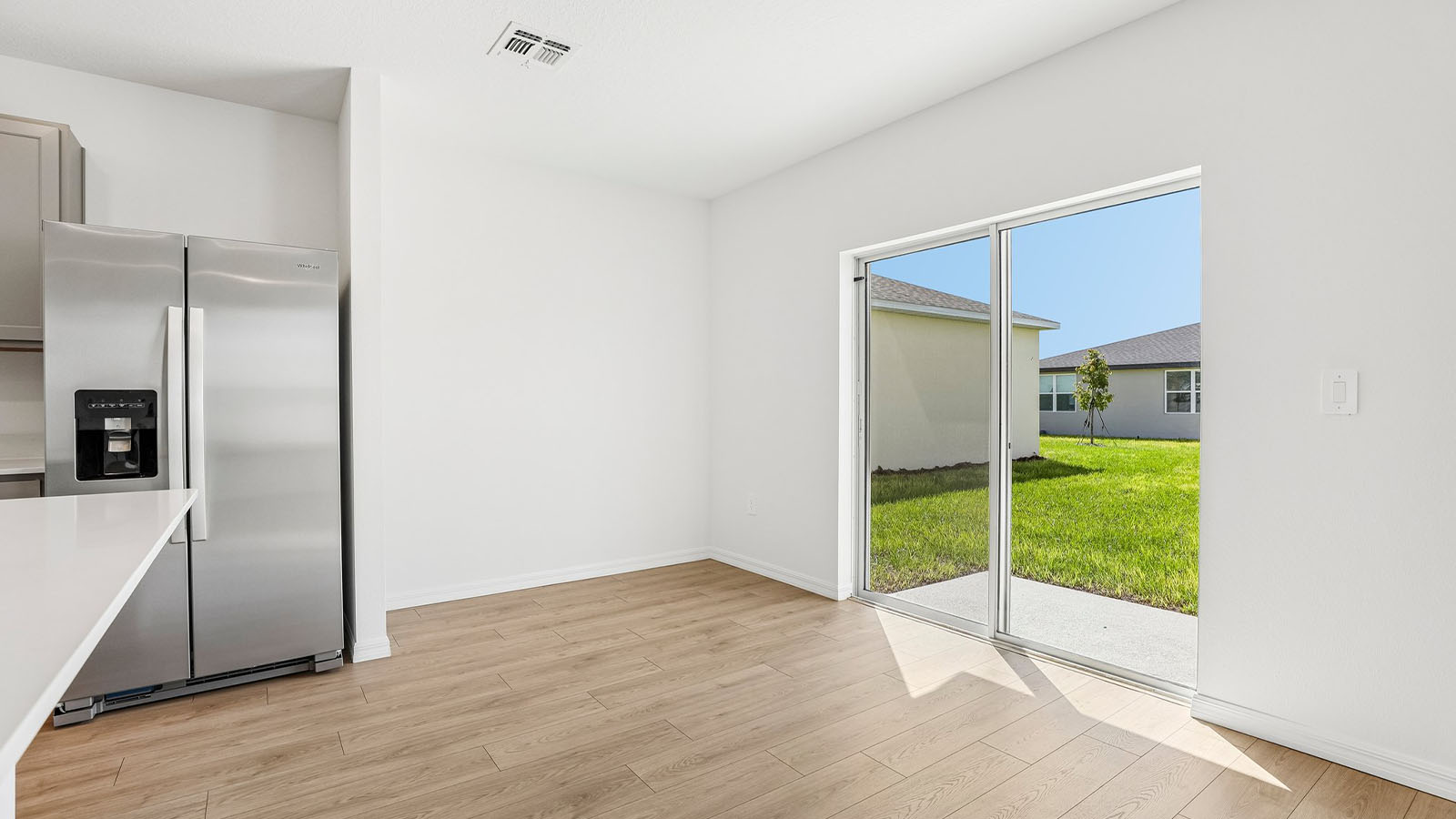 Dining area with sliding glass doors to rear lanai
