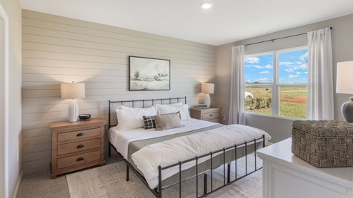 primary bedroom with a queen size bed