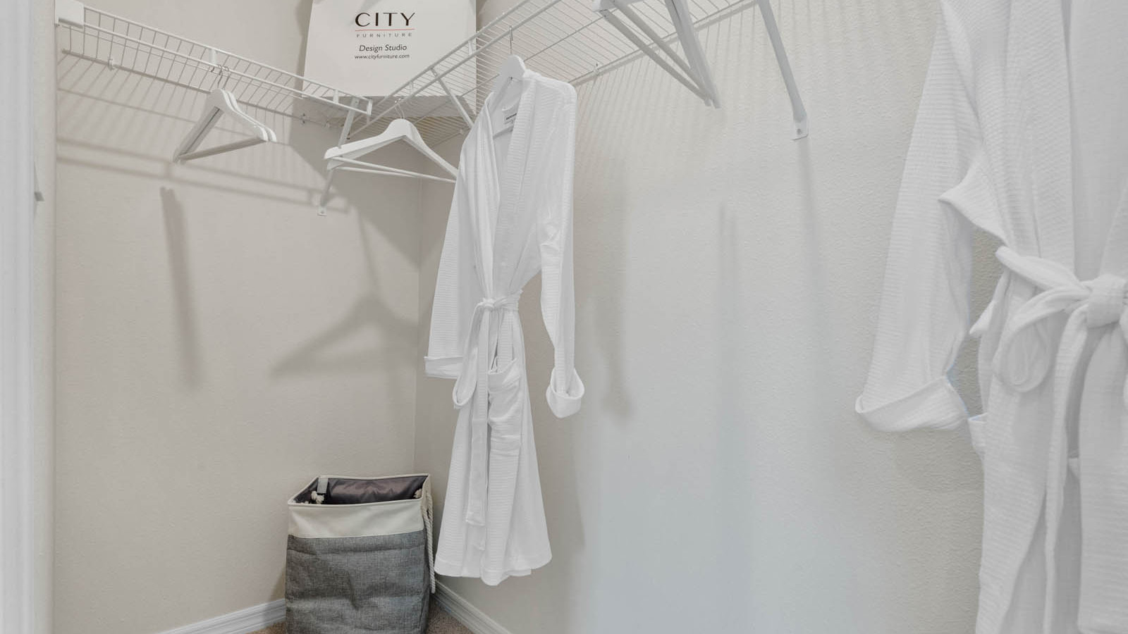 Primary bedroom walk in closet