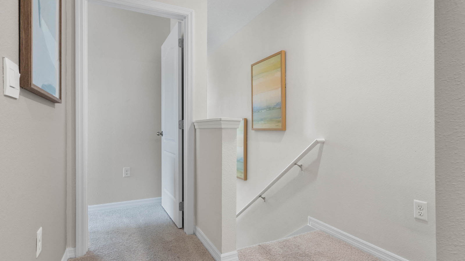 Upstairs hallway to primary bedroom