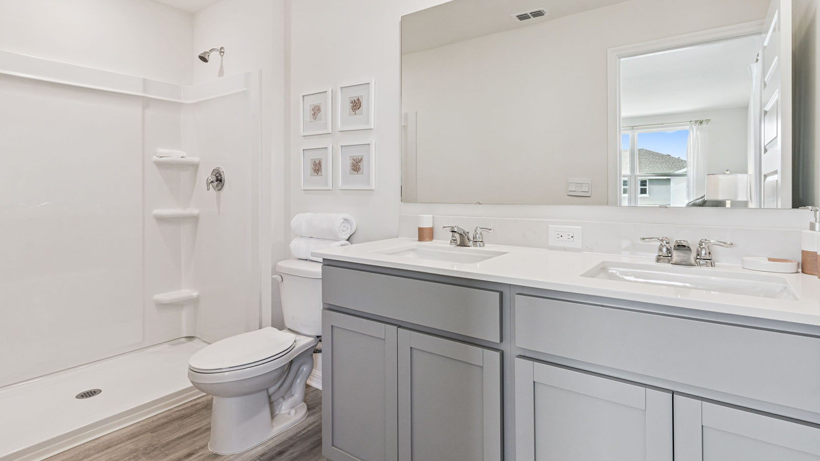 Primary bathroom attached bathroom with double vanity sinks and walk in shower