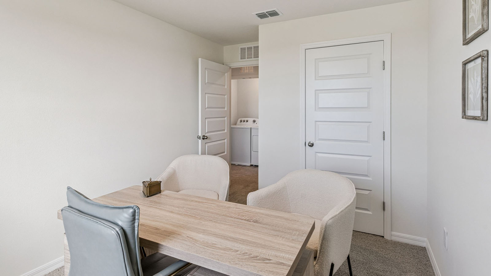 Office with desk, bookshelf and sitting area