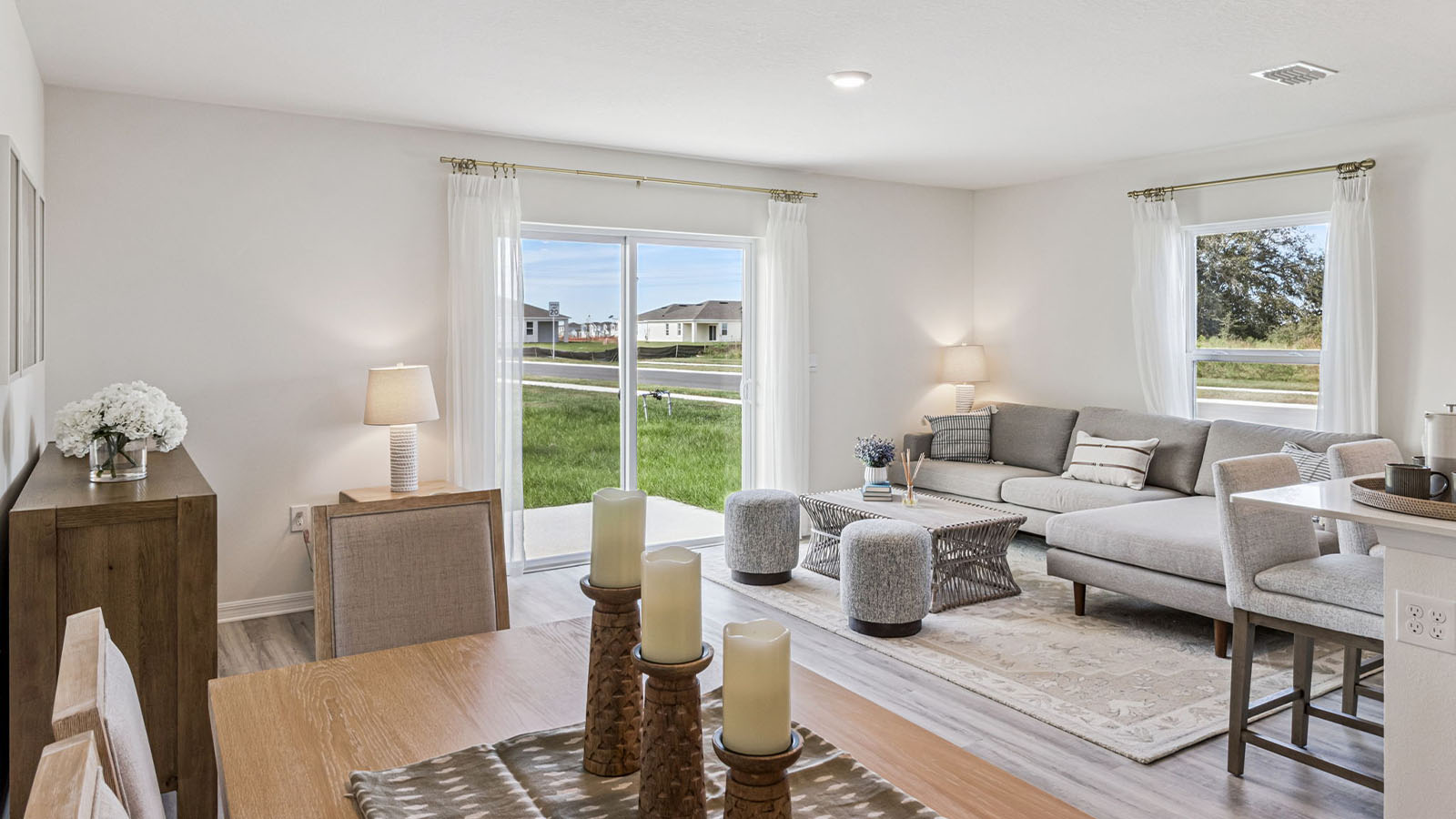 Living room with couch and T.V. set up looking to the patio