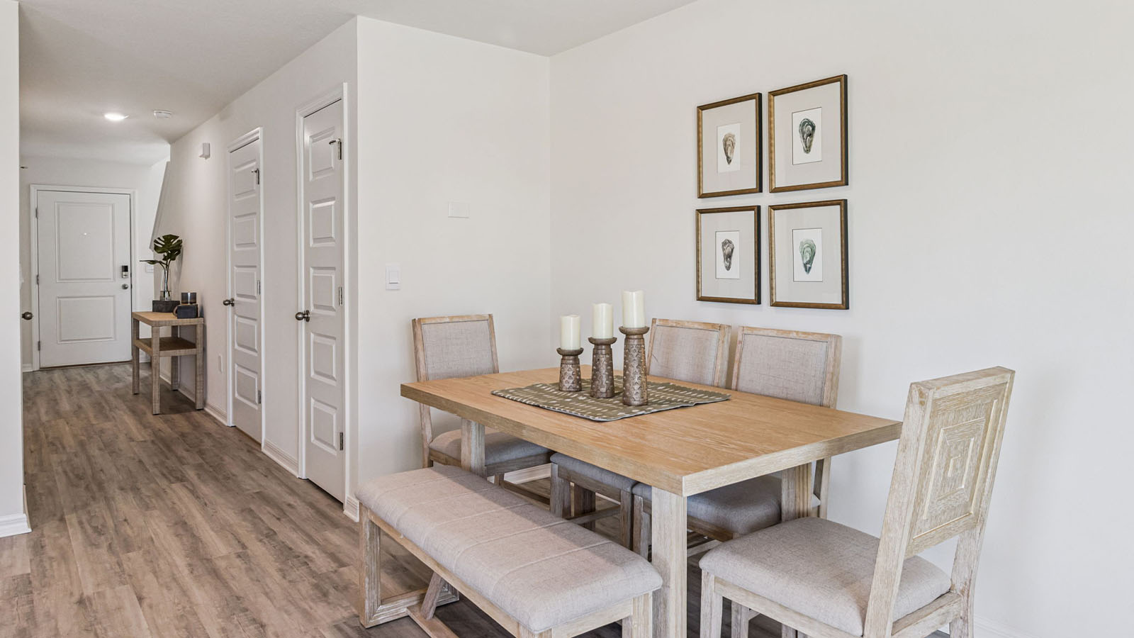 Dining room with 4 person round table looking to the living room
