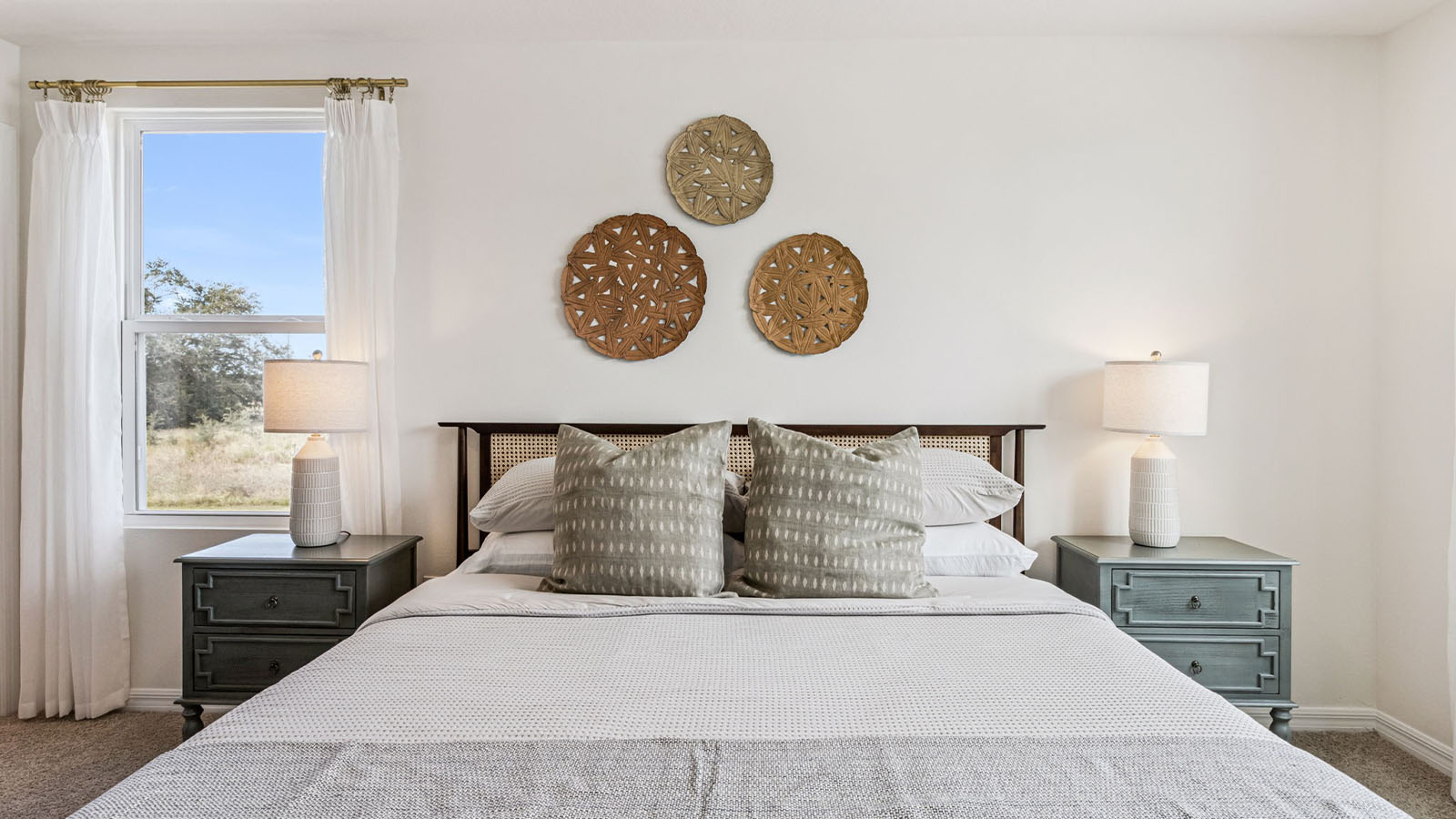 Primary bedroom with King size bed and dresser