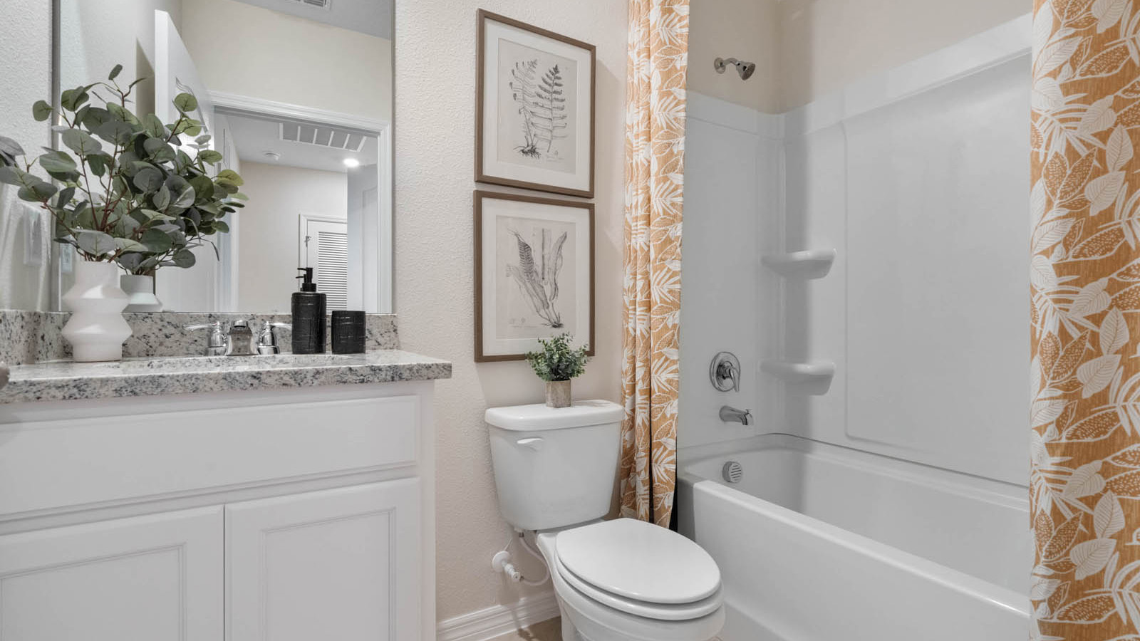 Guest bathroom with tub and single vanity