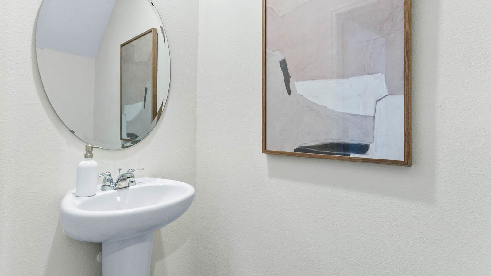 Half bathroom on main level with toilet and sink