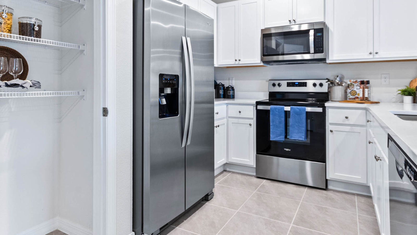 Spacious kitchen with pantry and stainless-steel appliances