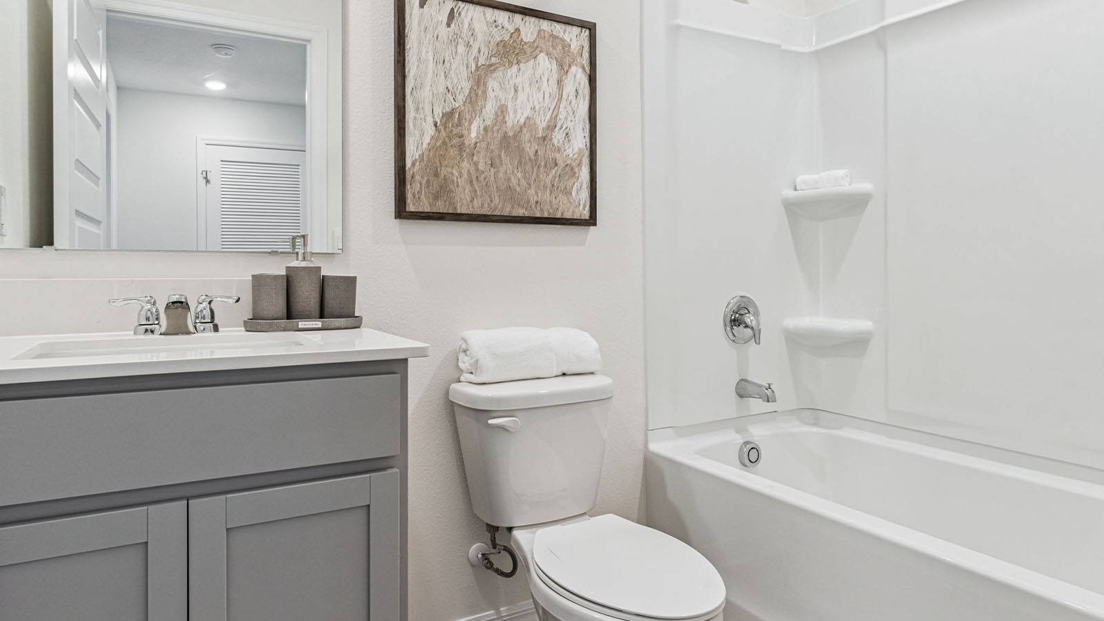 Primary bathroom attached bathroom with double vanity sinks and walk in shower