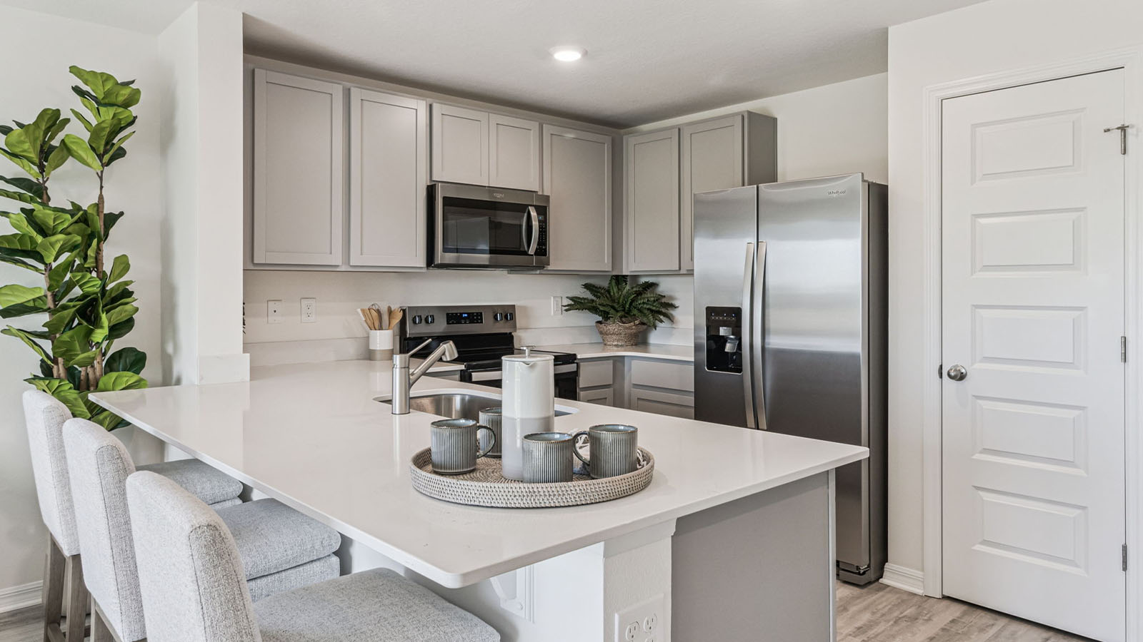 Open concept kitchen with peninsula overlooking living room