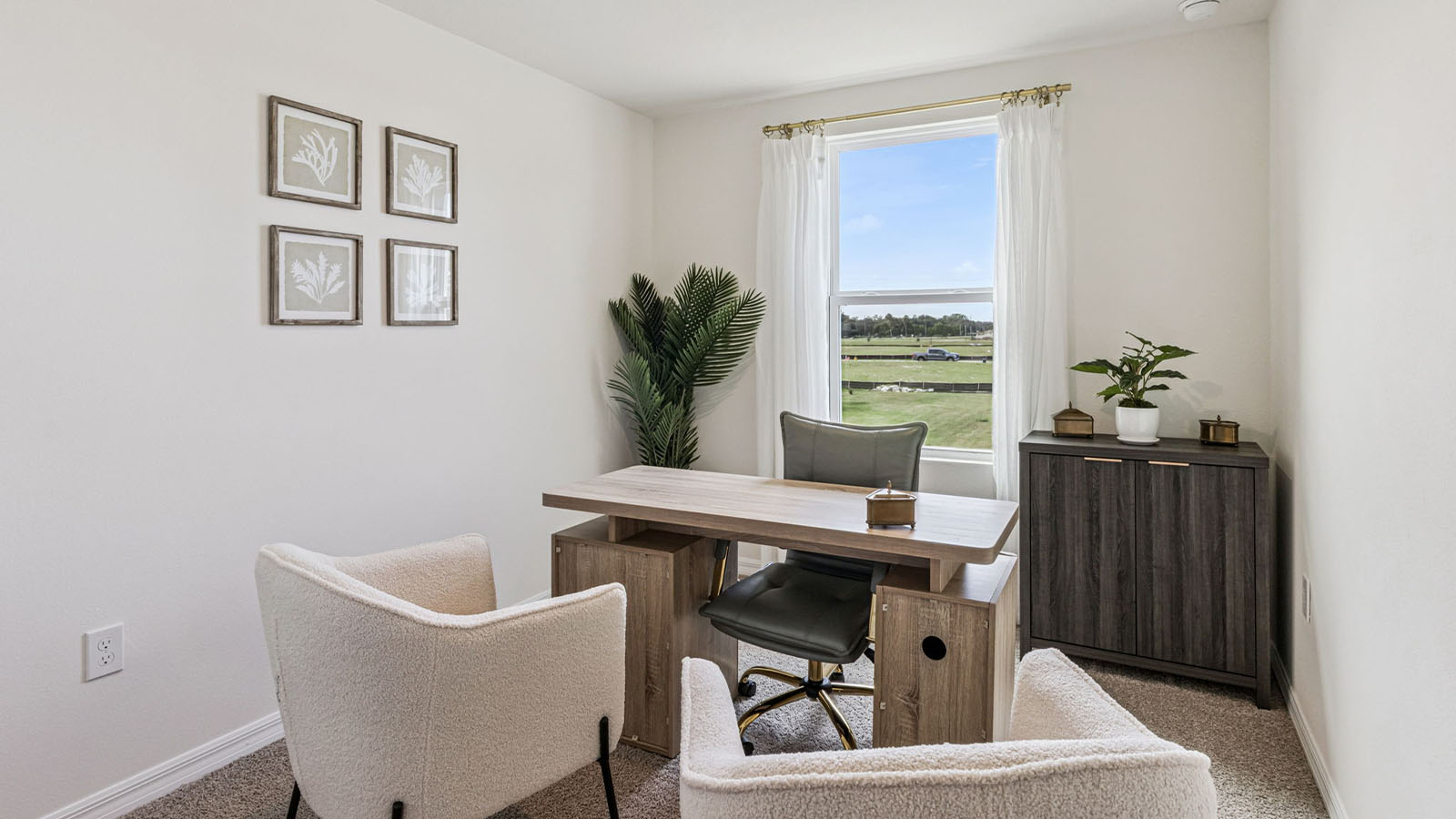 Office with desk, bookshelf and sitting area