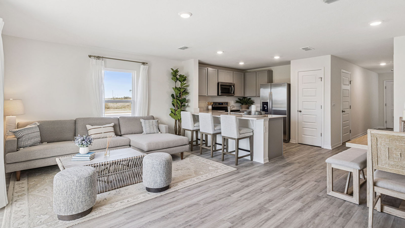 Living room with sectional couch and patio doors