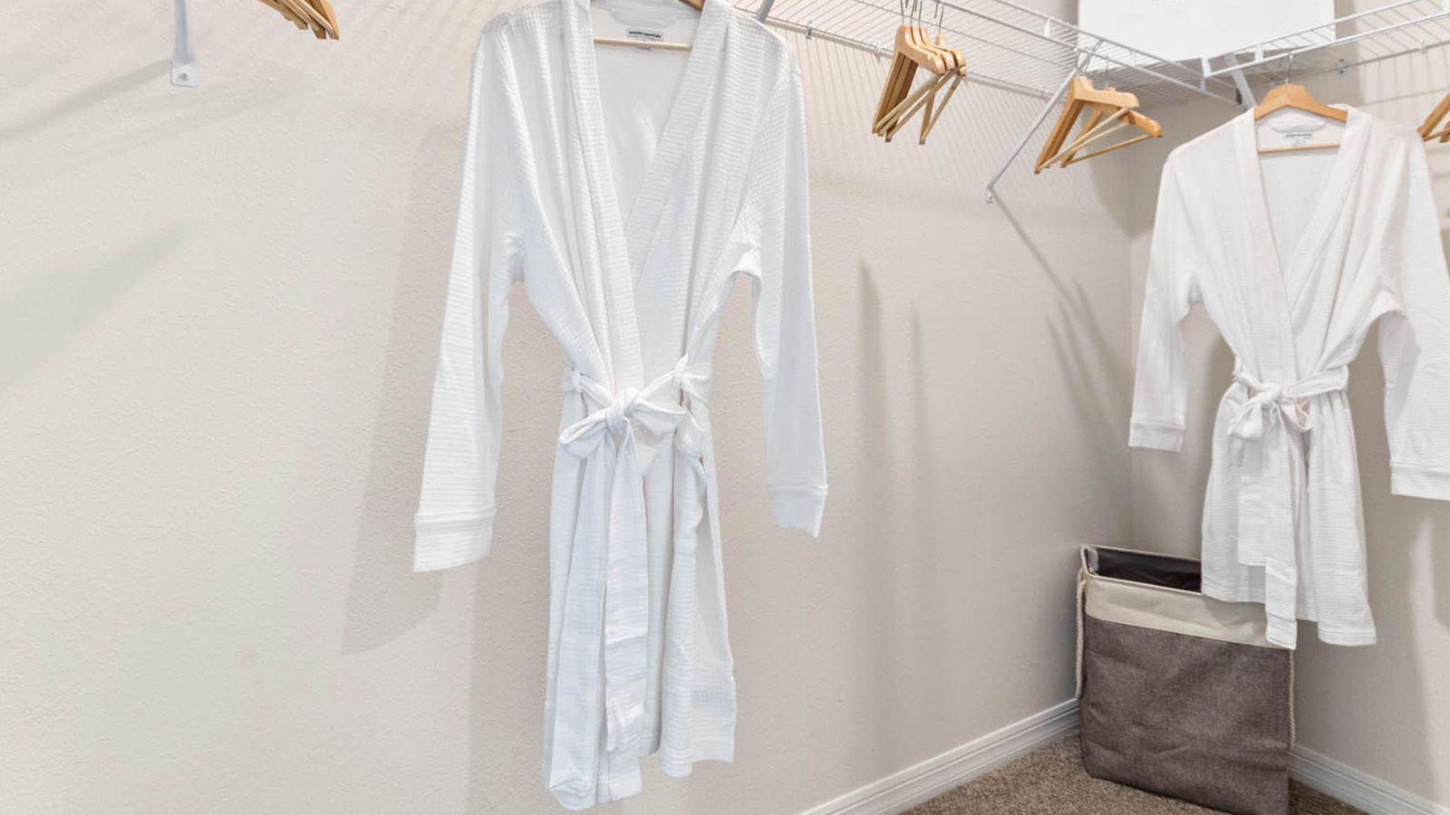 Primary bedroom walk in closet