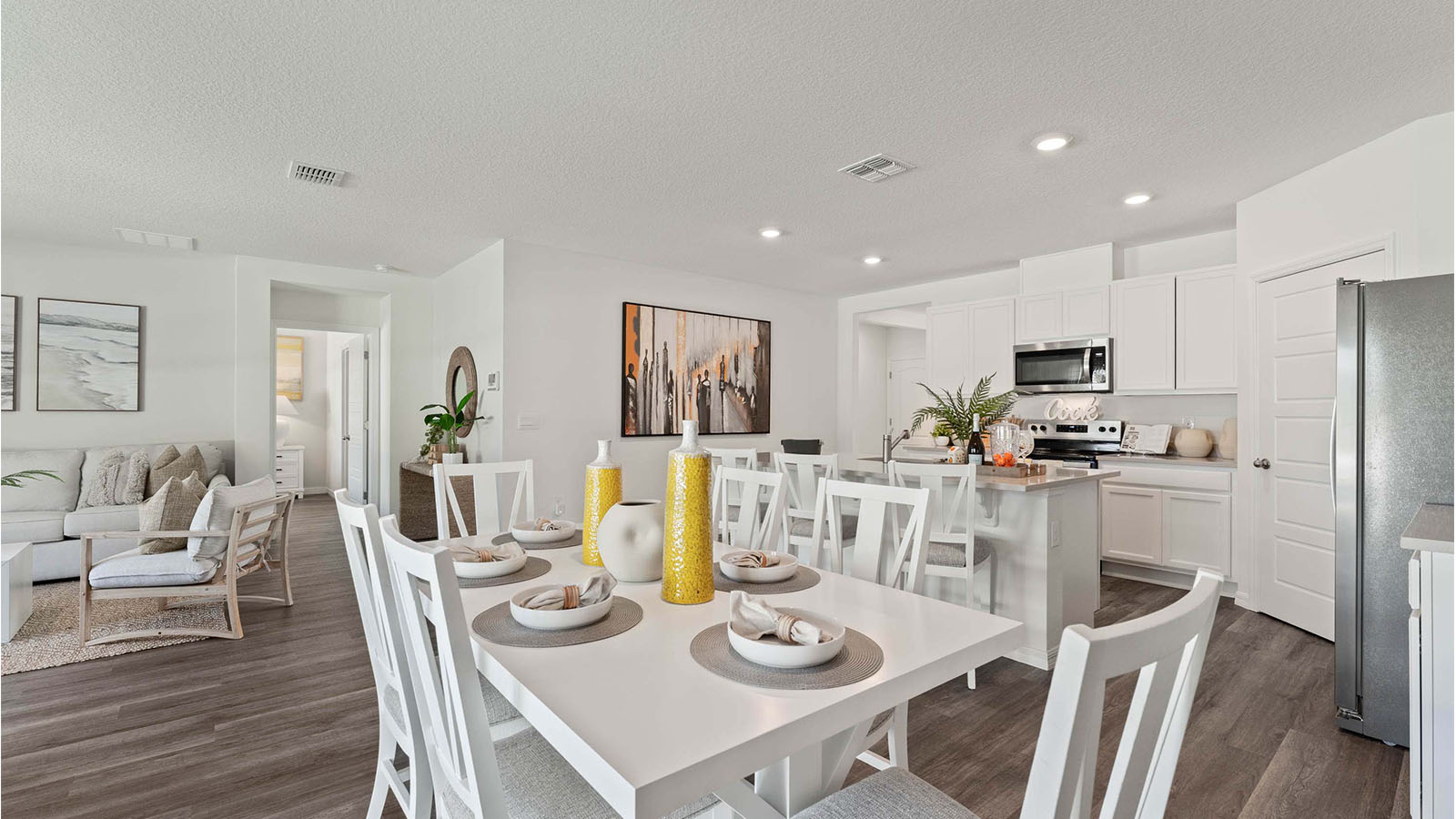 open concept living area of dining room looking to kitchen and living room