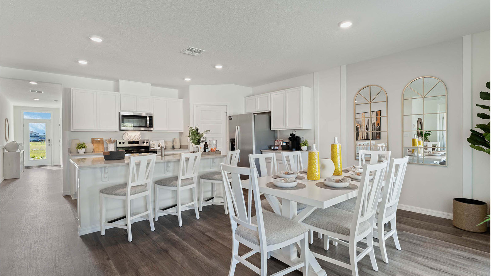 Open concept dining room and kitchen with seating