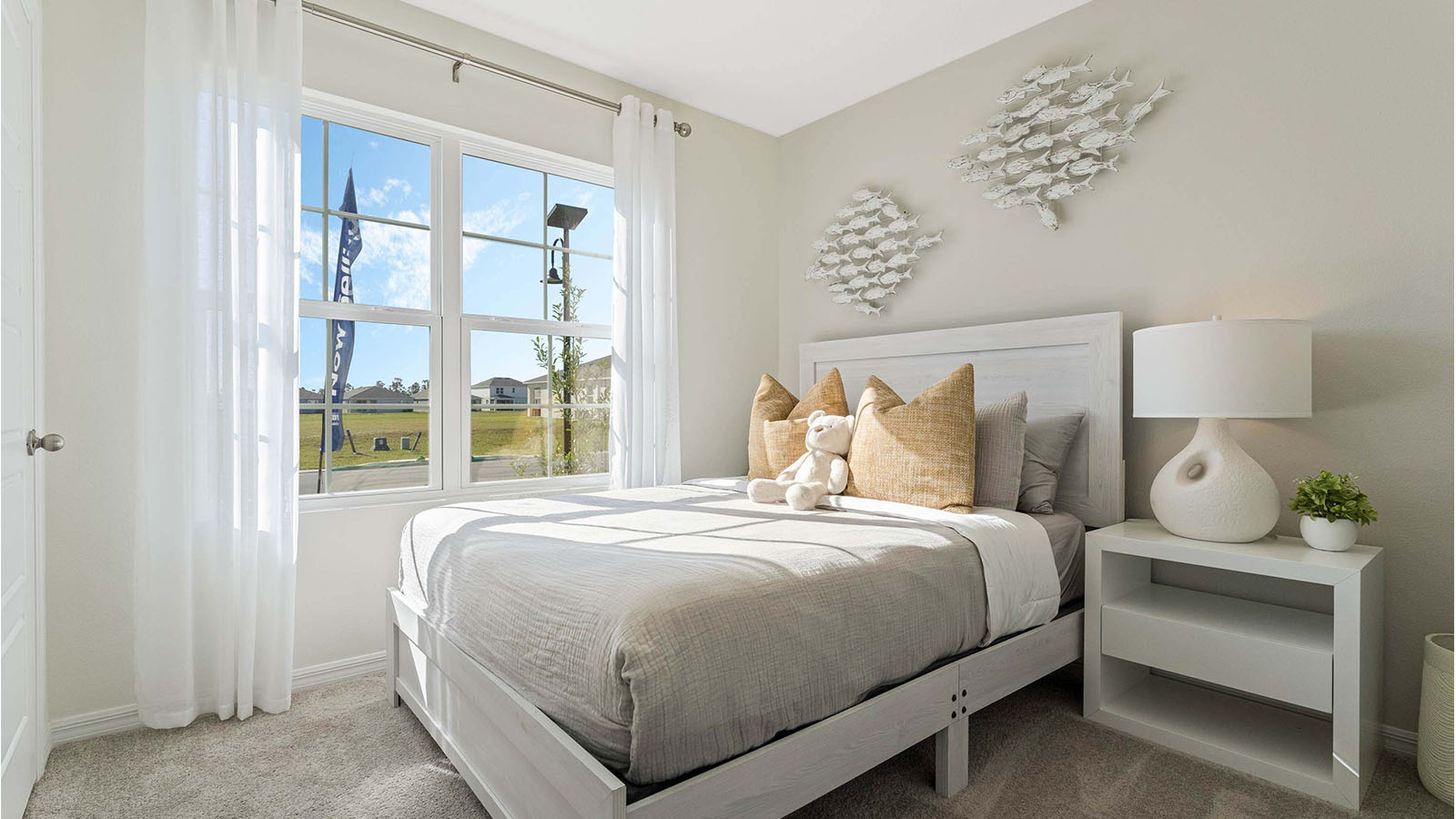 Guest room with queen size bed and night stand