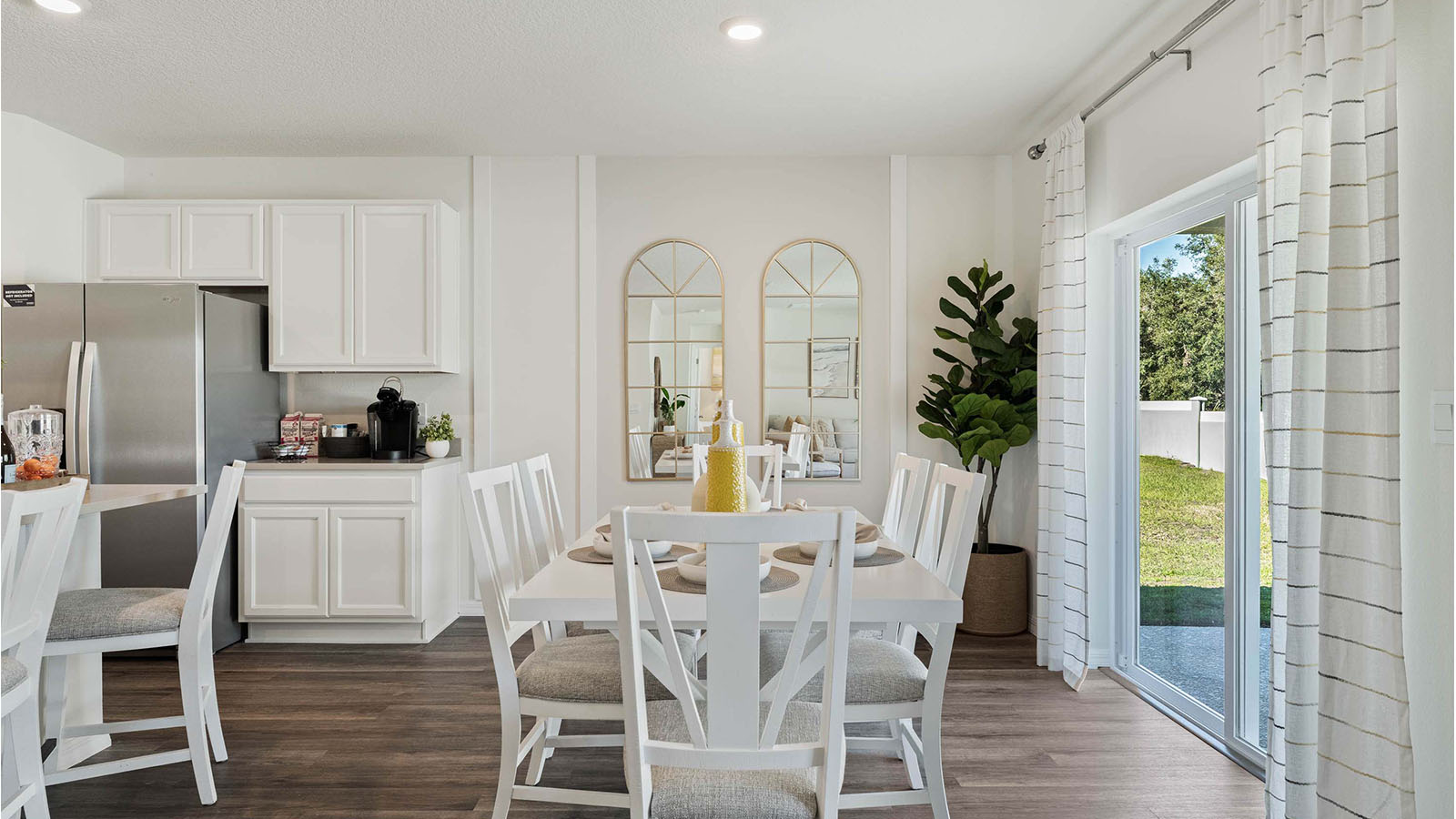 Dining room with 6 person table and patio doors