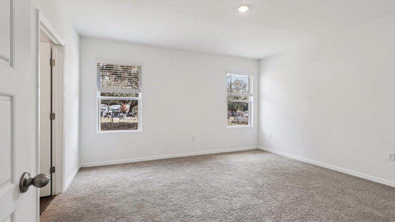 Primary bedroom with windows