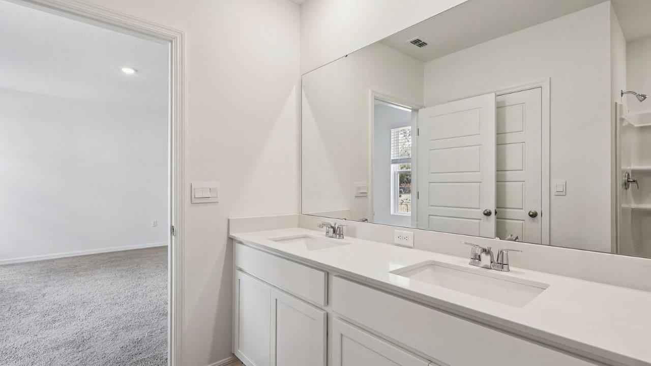 Primary bathroom with dual vanity sink