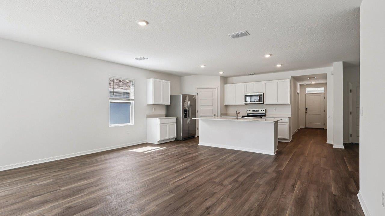 Living room with view of the kitchen