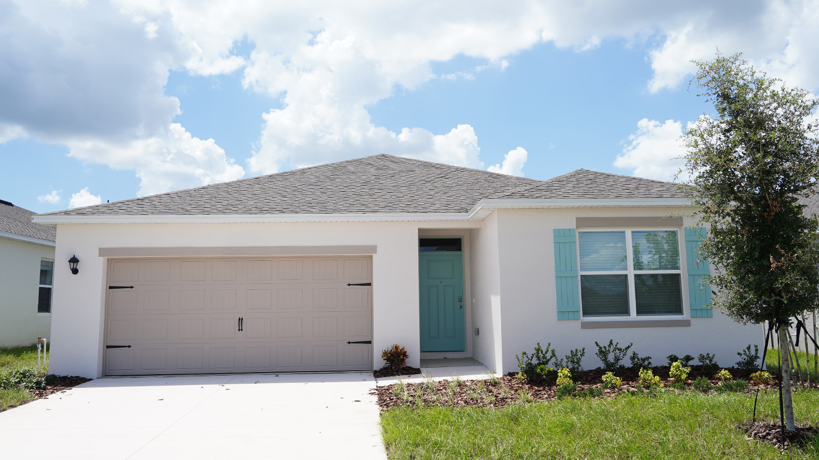 Exterior single family home with two car garage