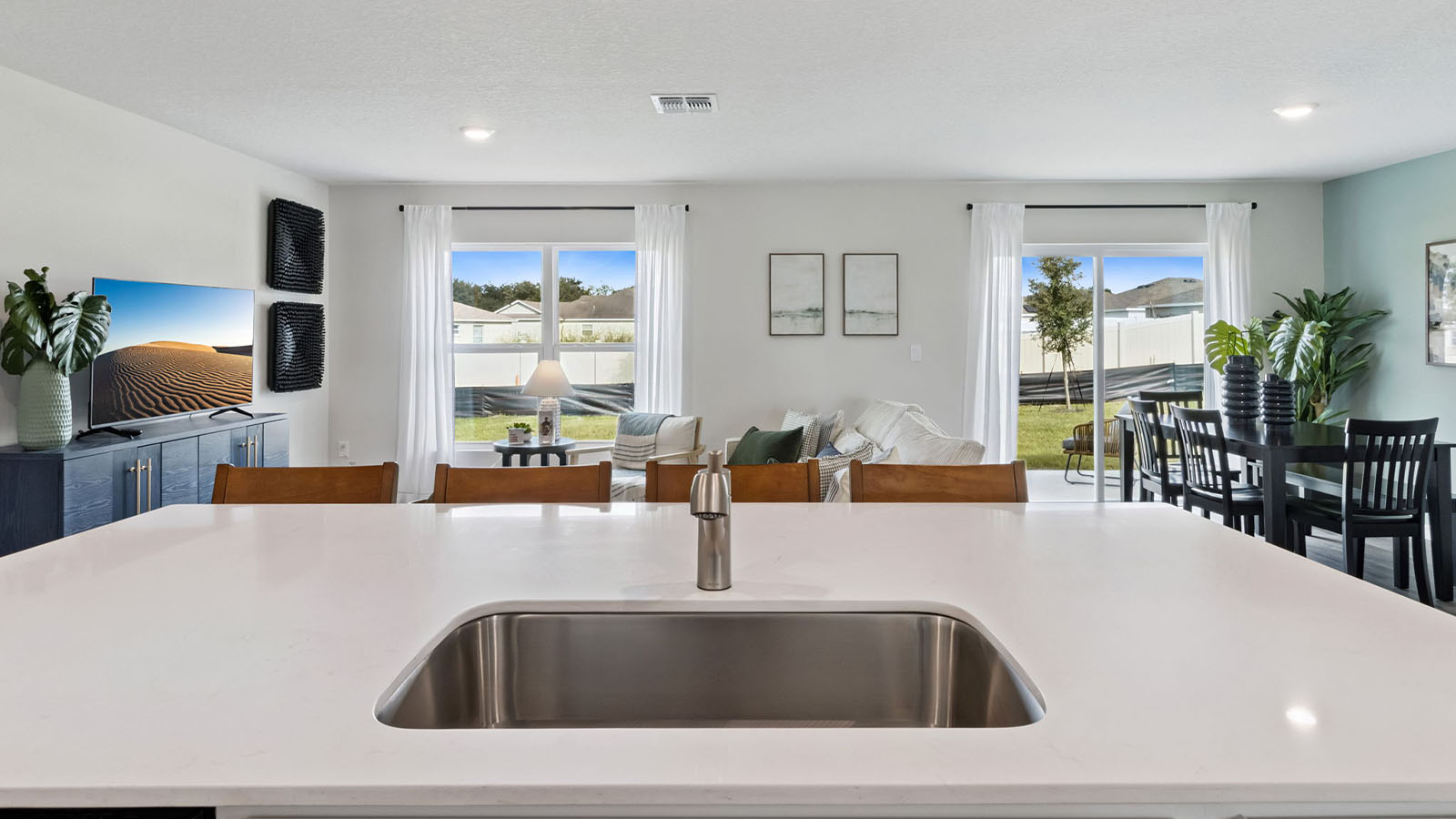 Kitchen island overlooking the living room and dinning room table
