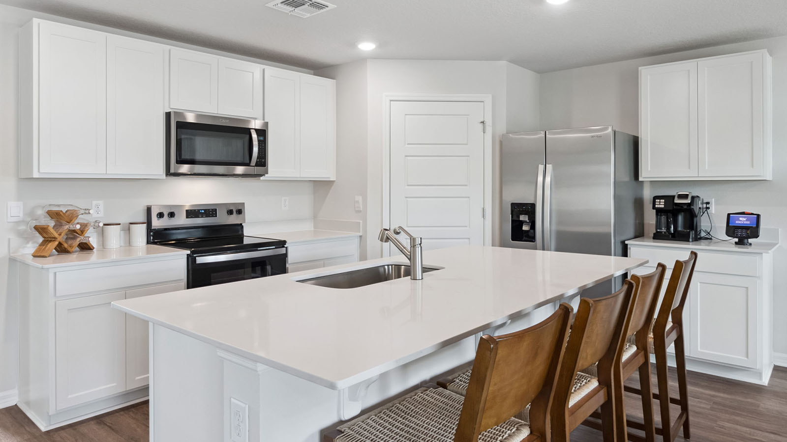 Kitchen island with stainless steel appliance