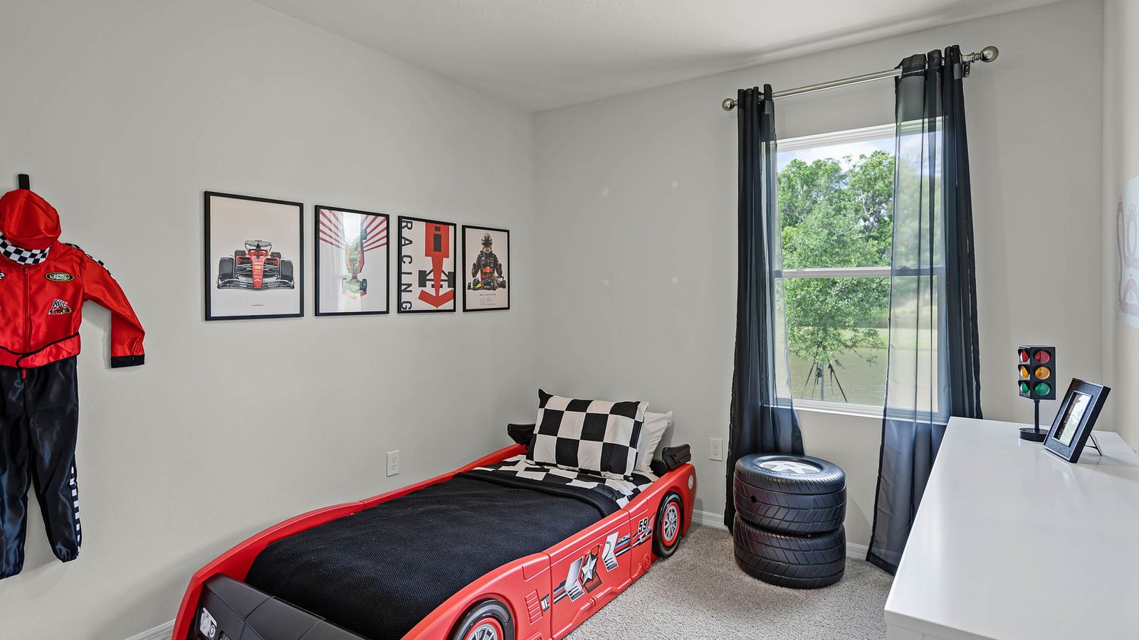 guest bedroom decorated as a racing room for a boy