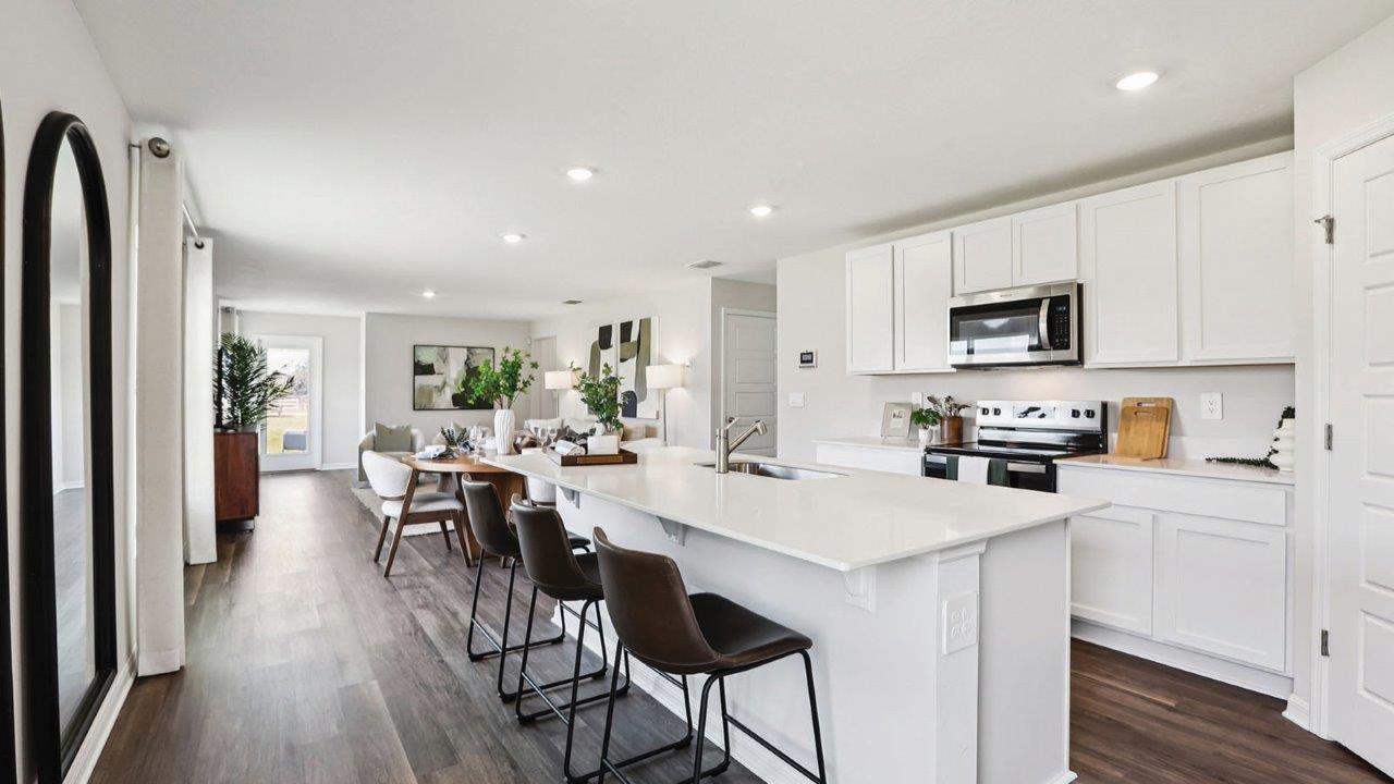 Kitchen with large island and white cabinets