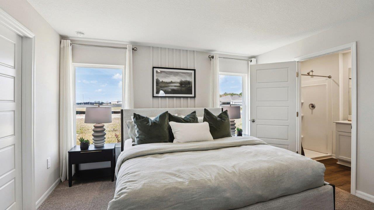 Primary bedroom with two windows for natural light