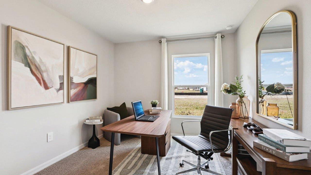 Office with desk, chairs and art