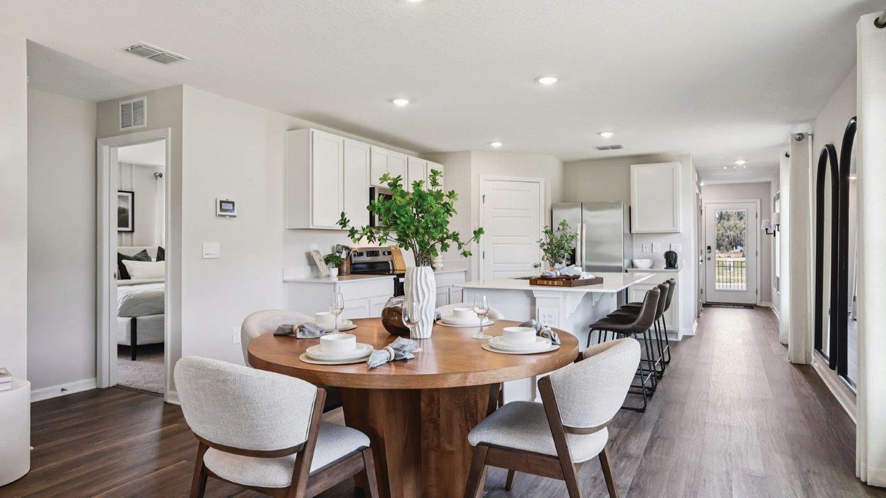 Dining room with view of kitchen and front entry