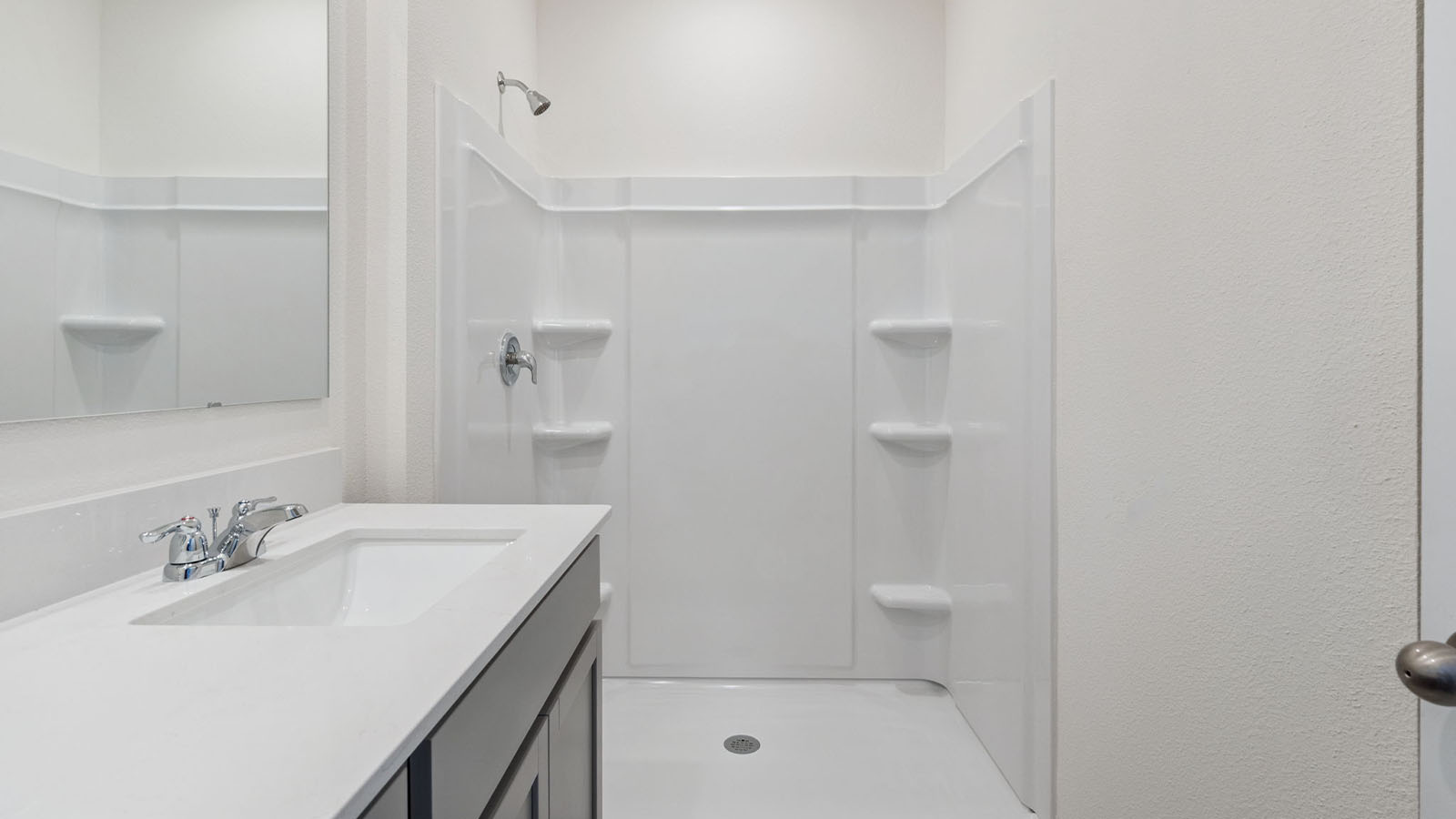 Primary bedroom with door to the primary bathroom