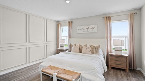 Primary bedroom with carpet throughout the room