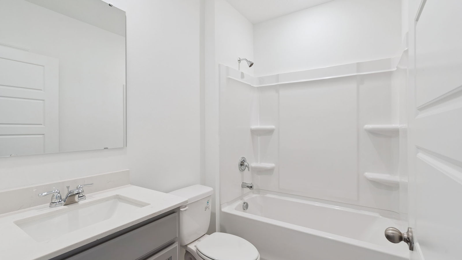 Guest bathroom with tub and single vanity sink