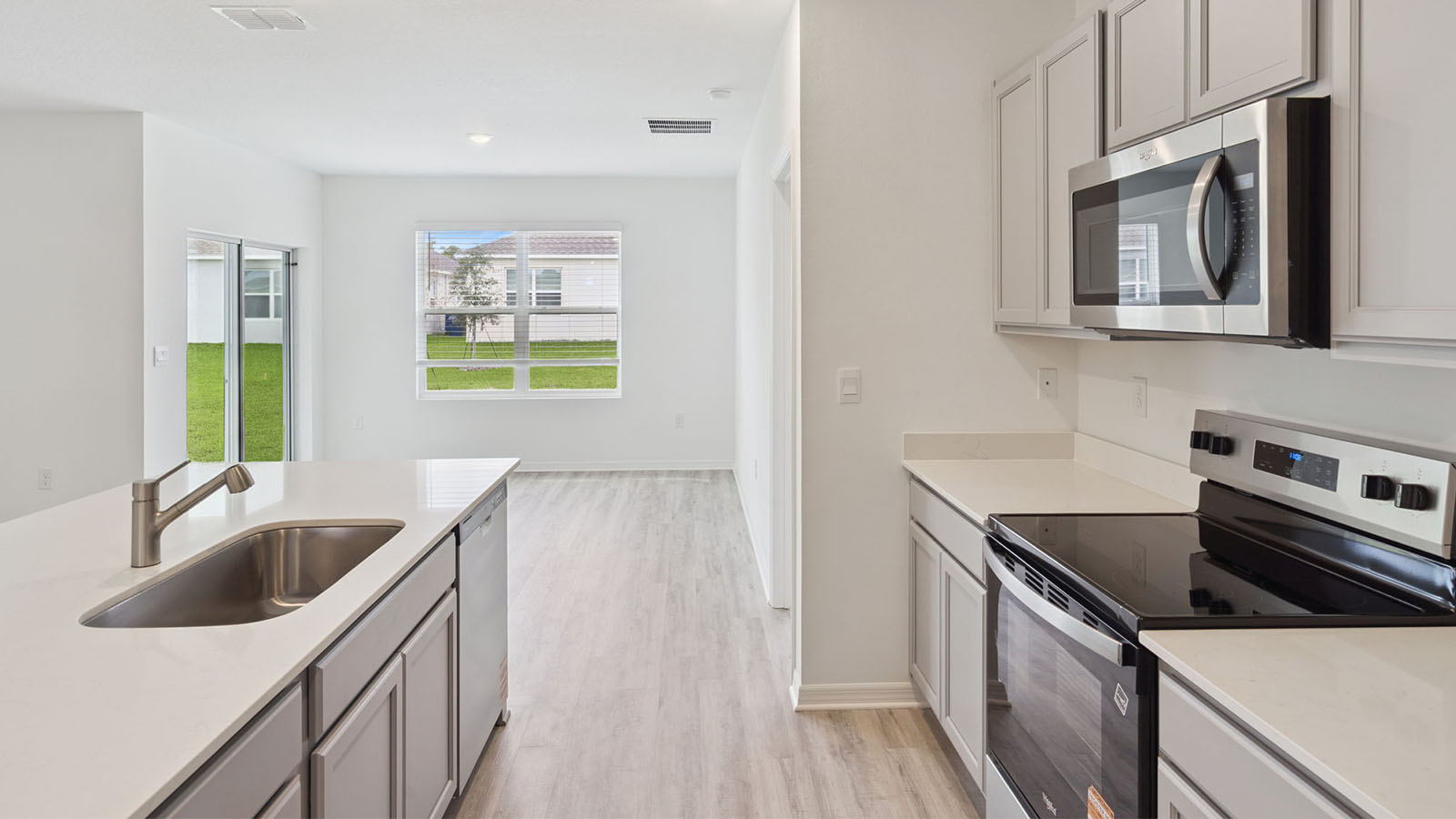 Kitchen with quartz countertops and stainless steel appliances