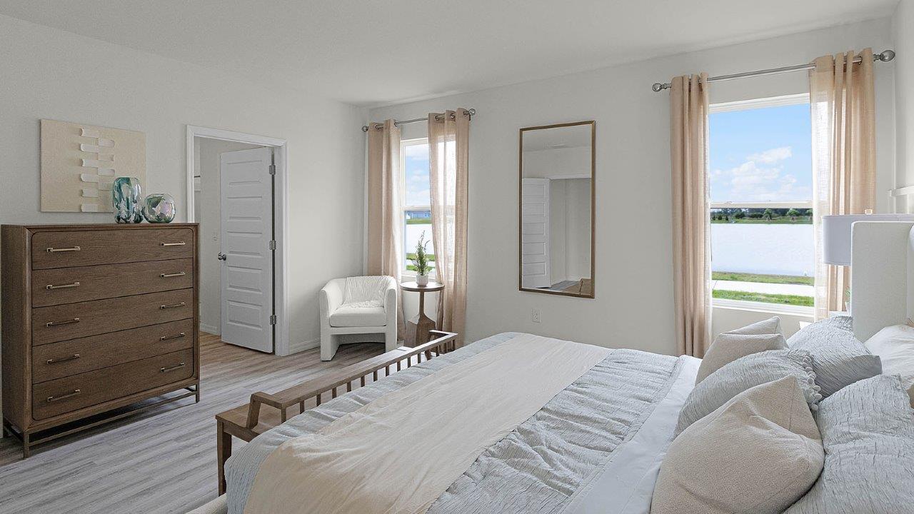 Spacious primary bedroom with attached bathroom
