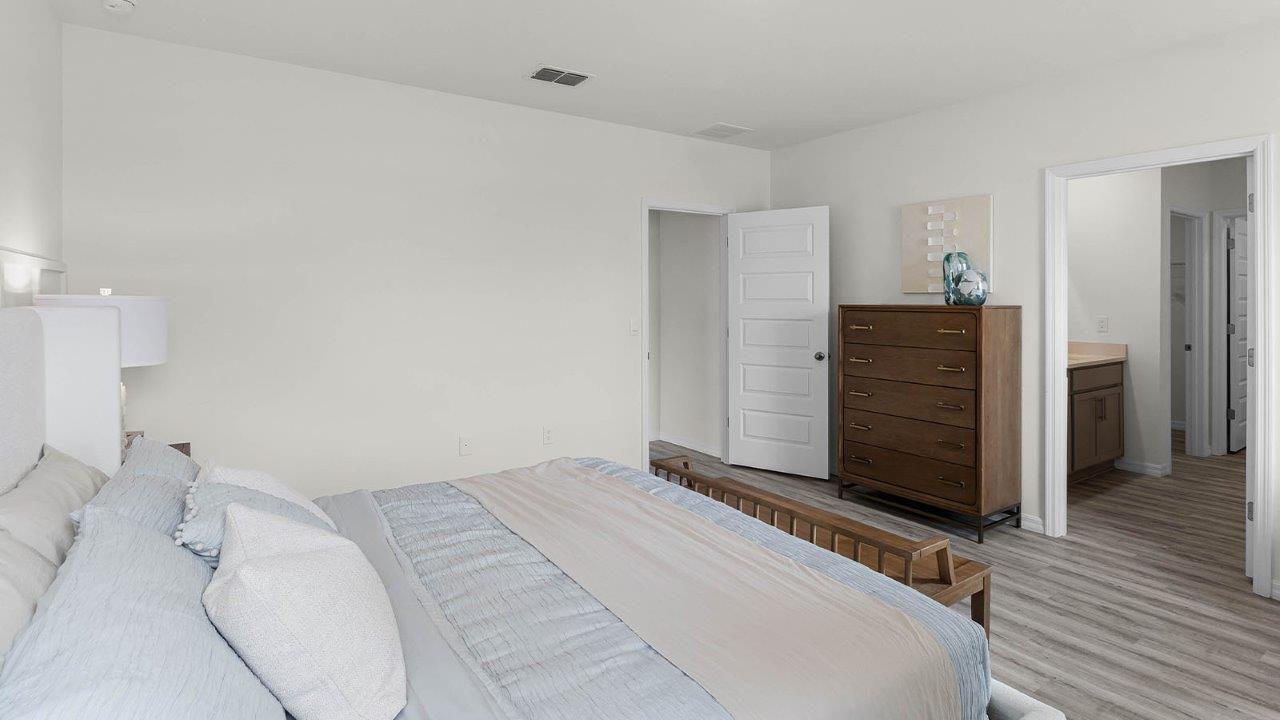 Primary bedroom and bathroom