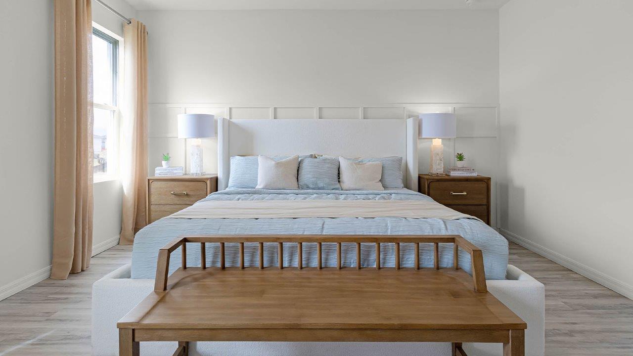 Spacious primary bedroom with king size bed