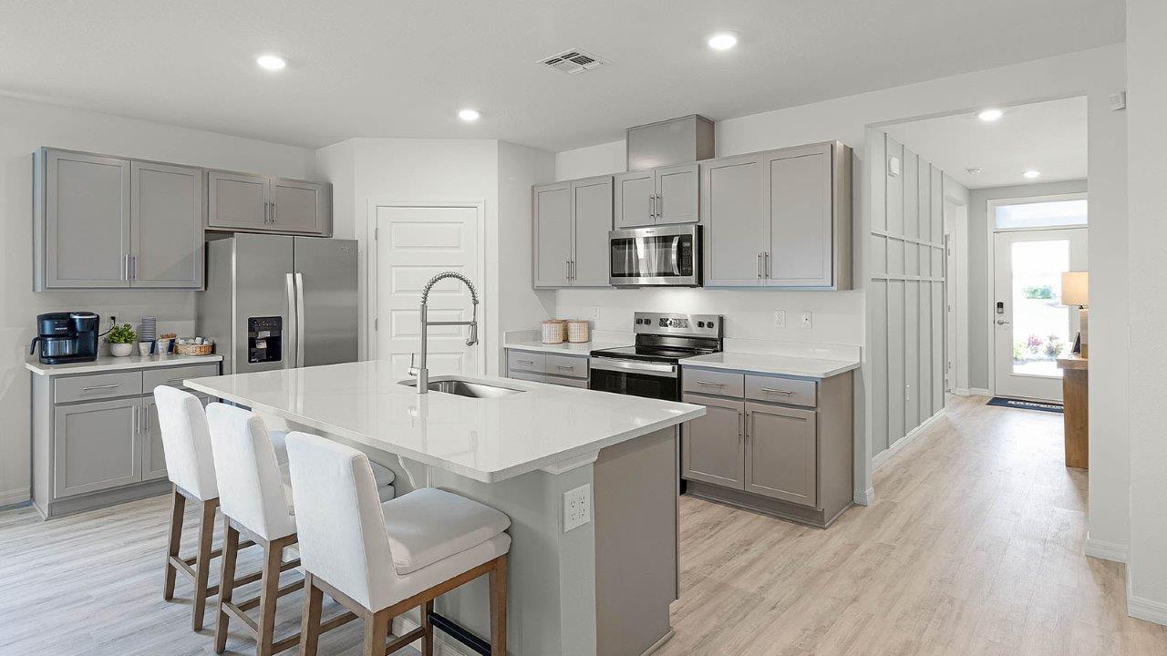 Kitchen with large island and stainless steel appliances