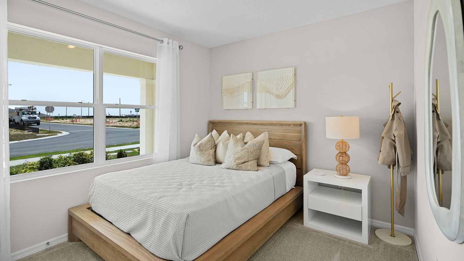 Guest bedroom with large windows and carpet