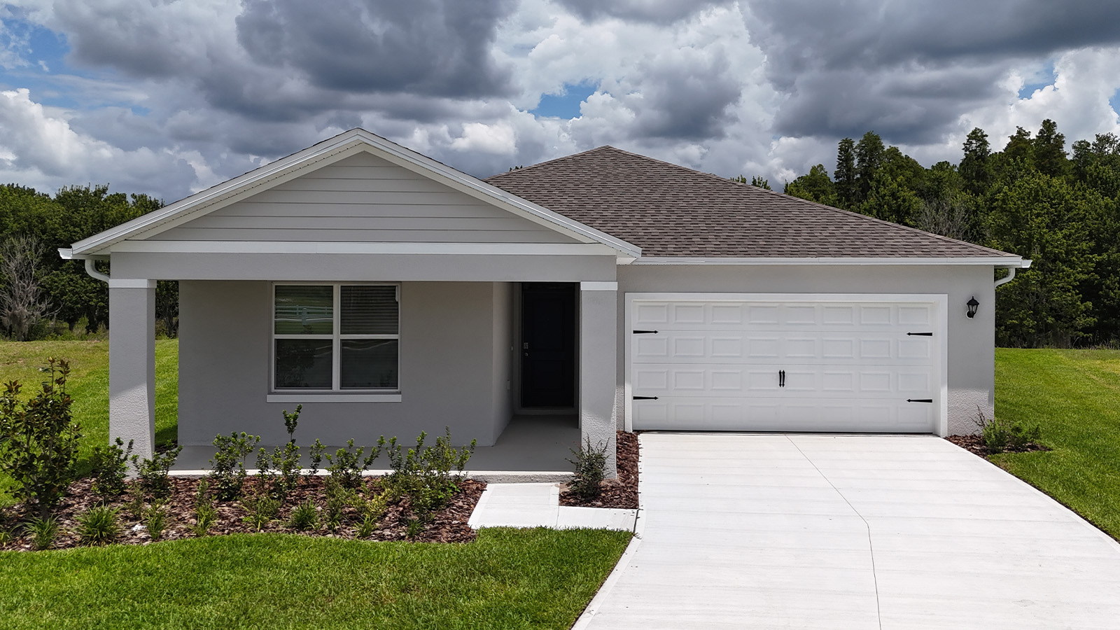 Exterior single family home with two car garage