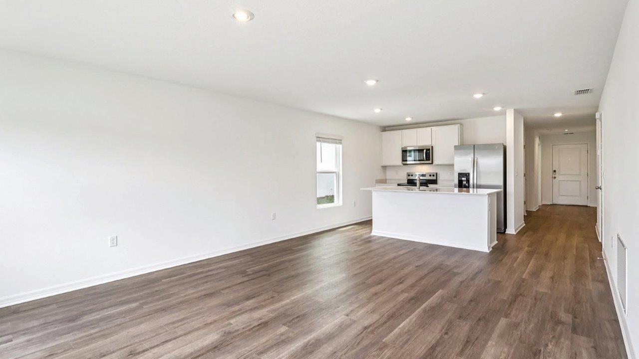 Kitchen island overlooking the living room and dinning room table