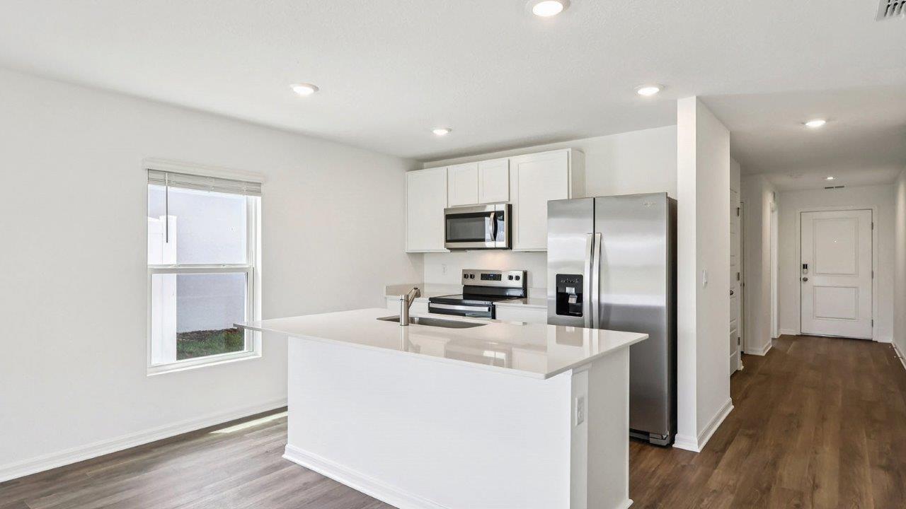 Kitchen island with stainless steel appliance