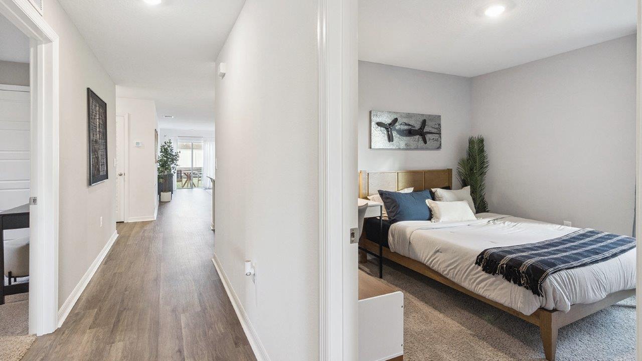 Guest bedroom with carpet flooring