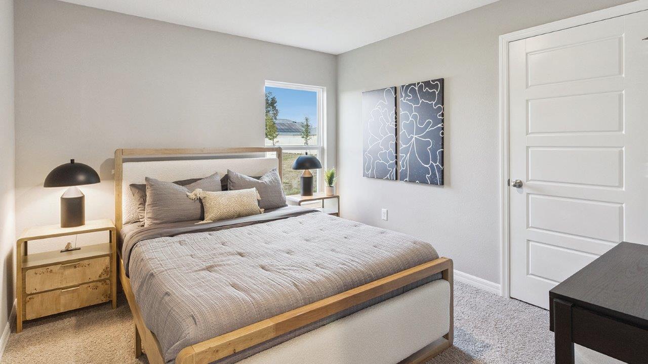 Guest bedroom 2 with carpet flooring