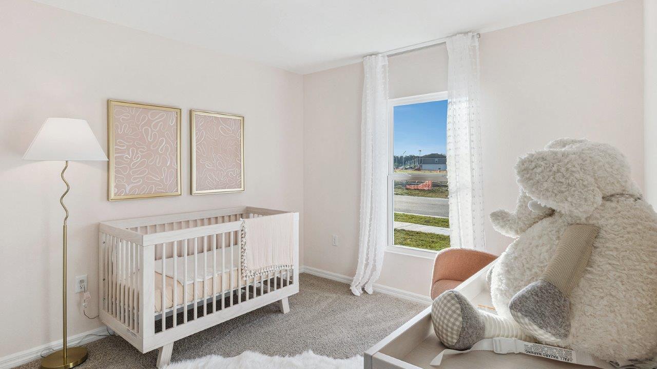 Nursery room with carpet throughout