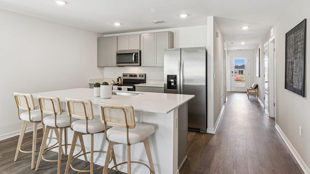 Kitchen island with stainless steel appliance