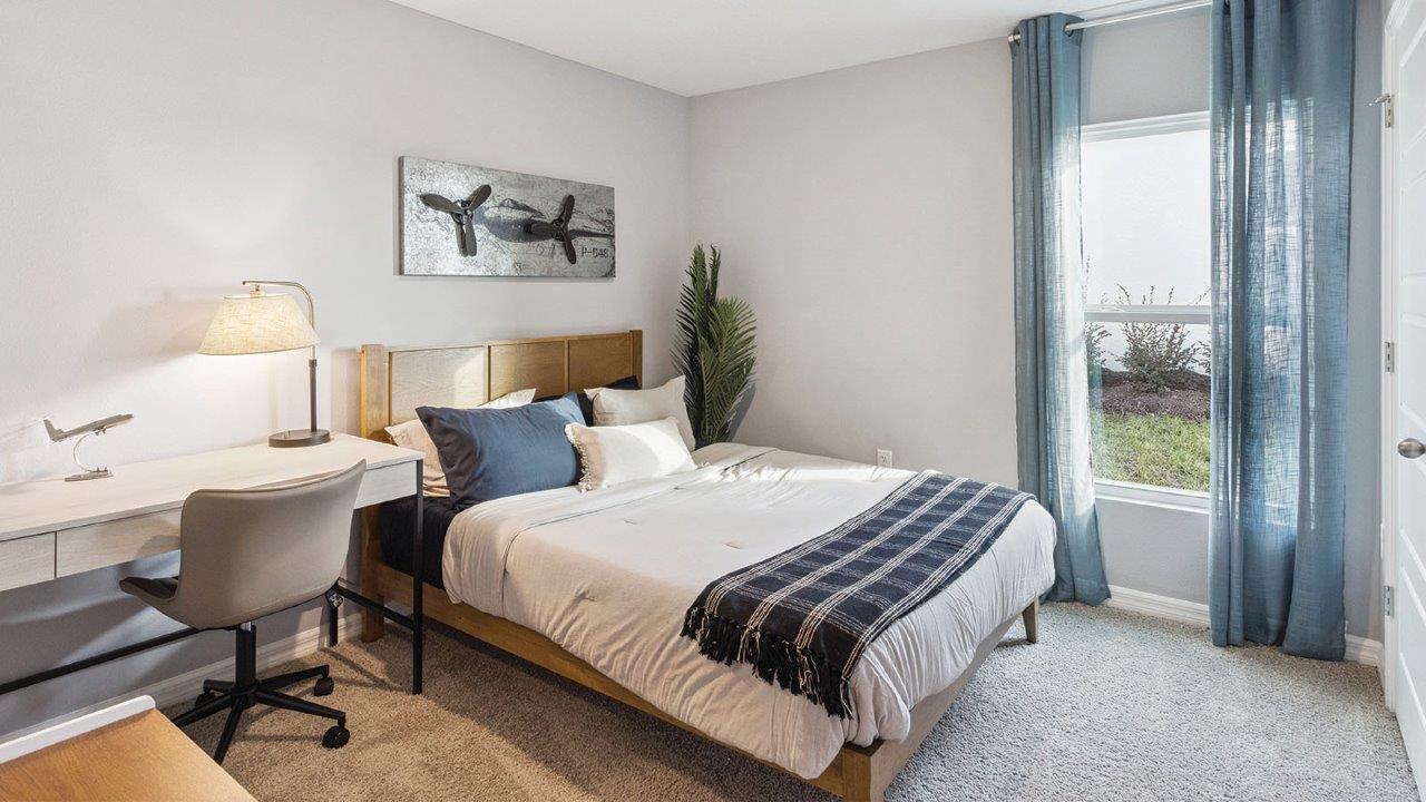 Guest bedroom with carpet flooring